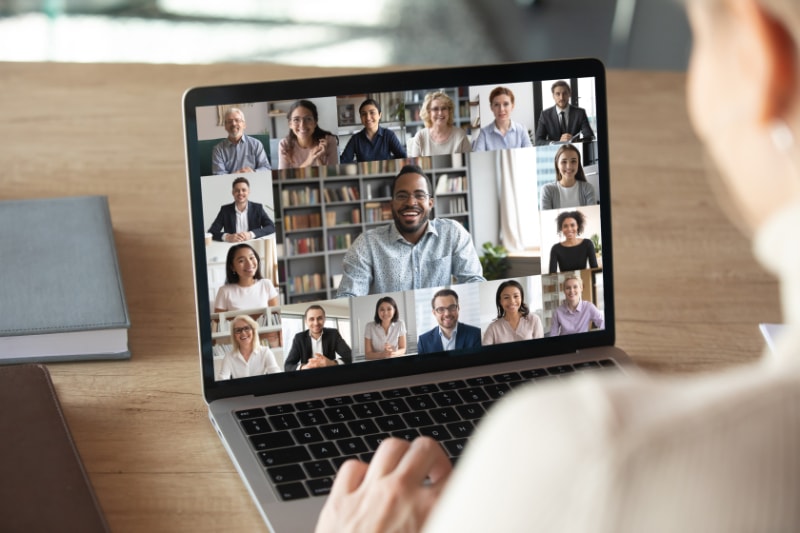 A laptop screen with a zoom meeting taking place.